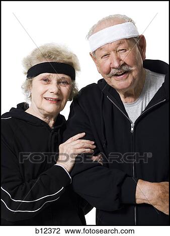 Stock Image - Senior couple in track suits. Fotosearch