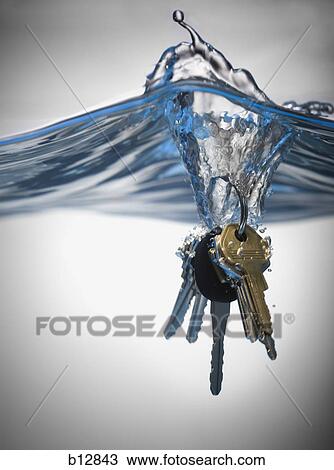 Set of keys dropped in water View Large Photo Image Stock Image - Set of keys dropped in water. Fotosearch