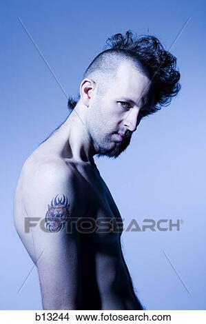 Shirtless man with half shaved hair and beard View Large Photo Image Picture - Shirtless man with half shaved hair and beard. Fotosearch