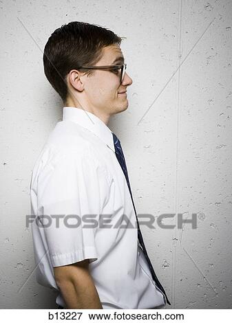 Stock Photo - Side profile of geeky businessman with glasses. Fotosearch