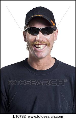 Stock Image - Slender man with a moustache smiling. Fotosearch