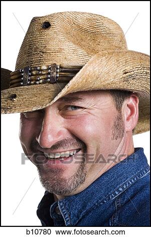 Stock Image - Smiling cowboy. Fotosearch