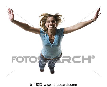 Stock Image - Smiling woman flying. Fotosearch