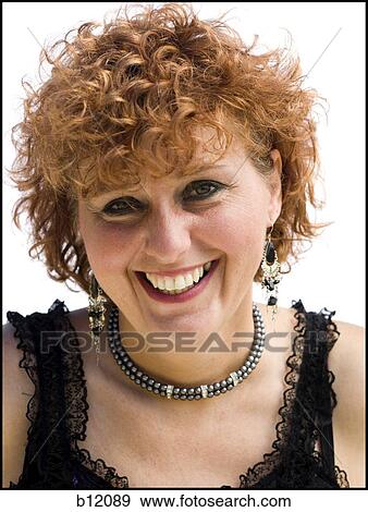 Stock Photo - Smiling woman with red hair. Fotosearch