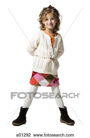Stock Image - Smiling young girl in white sweater. Fotosearch