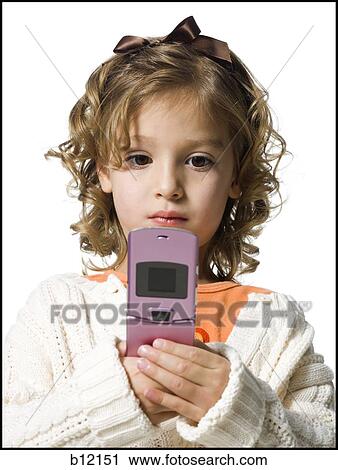 Smiling young girl in white sweater with cell phone View Large Photo Image Stock Image - Smiling young girl in white sweater with cell phone. Fotosearch