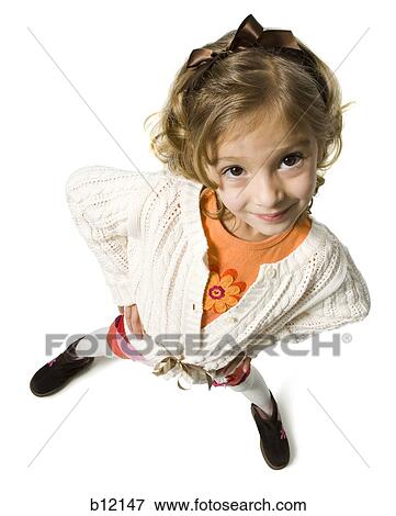 Stock Photo - Smiling young girl in white sweater. Fotosearch