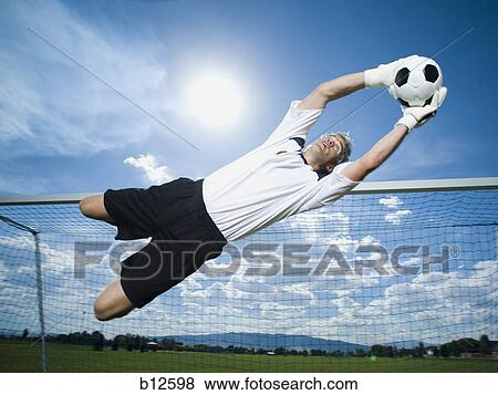 Soccer goalkeeper making diving save View Large Photo Image Stock Photo - Soccer goalkeeper making diving save. Fotosearch