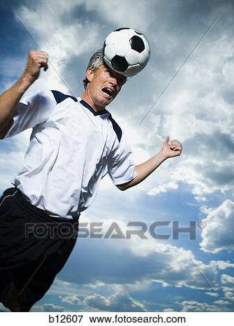 Soccer player heading ball View Large Photo Image Stock Photo - Soccer player heading ball. Fotosearch