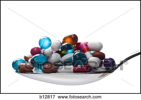 Stock Photo - Spoonful of pills and capsules. Fotosearch