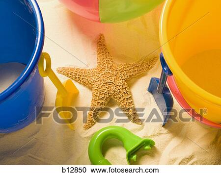 Starfish sand pail and beach toys View Large Photo Image Stock Image - Starfish sand pail and beach toys. Fotosearch