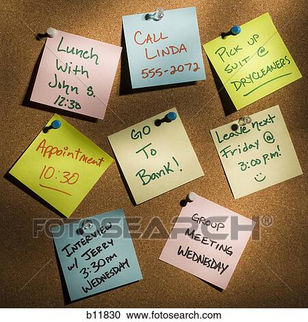 Stock Image - Sticky notes on a cork board. Fotosearch