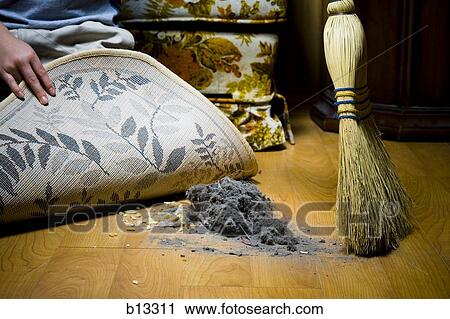 Sweeping dirt under rug View Large Photo Image Stock Image - Sweeping dirt under rug. Fotosearch