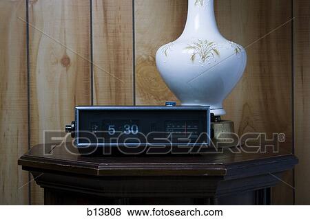 Table lamp and alarm clock at 5: 30 View Large Photo Image Stock Photo - Table lamp and alarm clock at 5: 30. Fotosearch