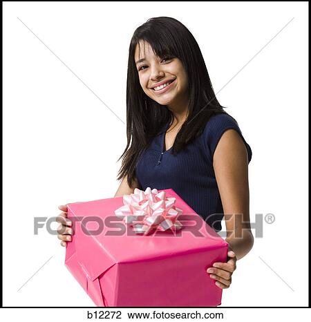 Stock Image - Teenage girl with gift. Fotosearch