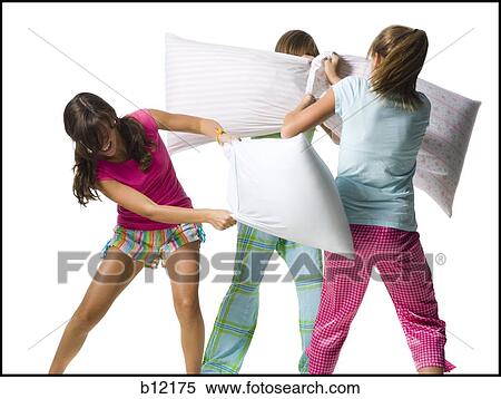 Three girls pillow fighting View Large Photo Image Stock Photography - Three girls pillow fighting. Fotosearch