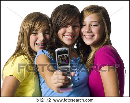 Three girls with camera phone View Large Photo Image Stock Image - Three girls with camera phone. Fotosearch