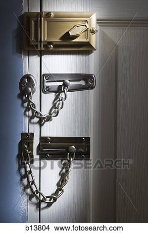 Three locks on door View Large Photo Image Picture - Three locks on door. Fotosearch