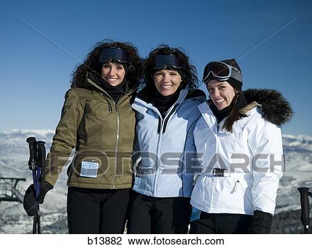 Three women outdoors in winter skiing View Large Photo Image Stock Image - Three women outdoors in winter skiing. Fotosearch