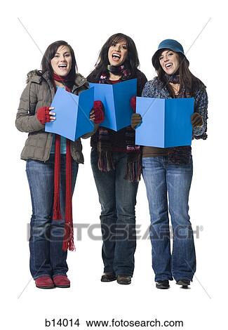 Three women singing with winter coats and sheet music View Large Photo Image Picture - Three women singing with winter coats and sheet music. Fotosearch