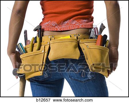 Toolbelt on a woman's waist View Large Photo Image Stock Photo - Toolbelt on a woman's waist. Fotosearch