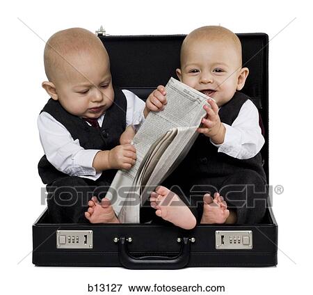 Twin baby boys in briefcase with suits and newspaper View Large Photo Image Stock Photo - Twin baby boys in briefcase with suits and newspaper. Fotosearch