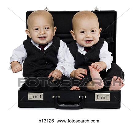 Twin baby boys in briefcase with suits View Large Photo Image Stock Photograph - Twin baby boys in briefcase with suits. Fotosearch