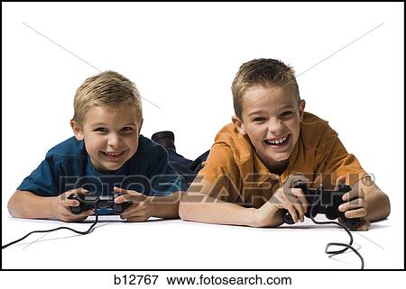 Two brothers playing a video game View Large Photo Image Stock Photo - Two brothers playing a video game. Fotosearch