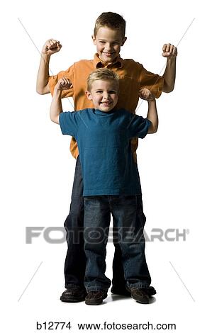 Picture - Two brothers posing and flexing muscles. Fotosearch