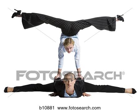 Two female contortionist businesswomen View Large Photo Image Stock Image - Two female contortionist businesswomen. Fotosearch