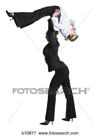 Stock Photo - Two female contortionist businesswomen. Fotosearch