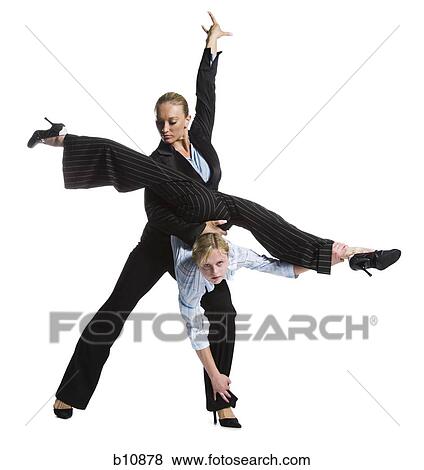 Two female contortionist businesswomen View Large Photo Image Stock Photo - Two female contortionist businesswomen. Fotosearch