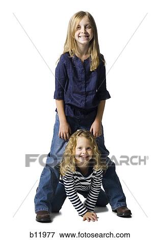 Two girls playing together View Large Photo Image Stock Photo - Two girls playing together. Fotosearch
