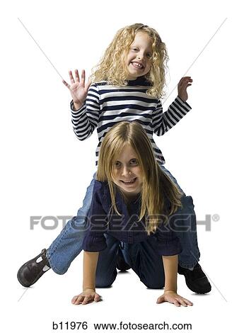 Two girls playing together View Large Photo Image Stock Photograph - Two girls playing together. Fotosearch