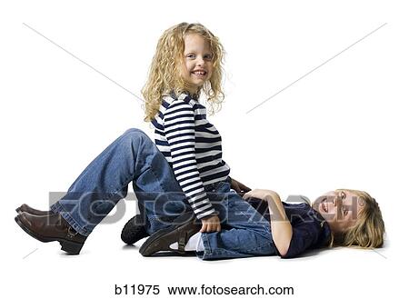 Two girls playing together View Large Photo Image Stock Photography - Two girls playing together. Fotosearch