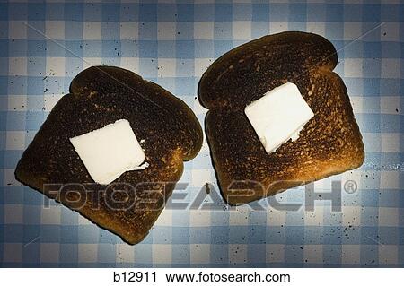 Two slices of burnt toast View Large Photo Image Stock Image - Two slices of burnt toast. Fotosearch