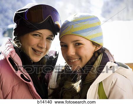 Two teenage girls outdoors in winter with toques View Large Photo Image Stock Image - Two teenage girls outdoors in winter with toques. Fotosearch