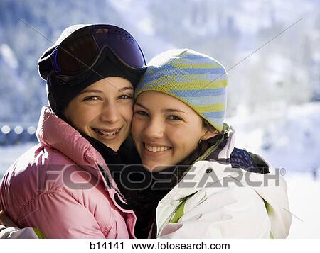 Two teenage girls outdoors in winter with toques View Large Photo Image Stock Image - Two teenage girls outdoors in winter with toques. Fotosearch