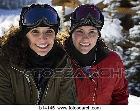 Two women with ski goggles outdoors in winter View Large Photo Image Stock Photography - Two women with ski goggles outdoors in winter. Fotosearch