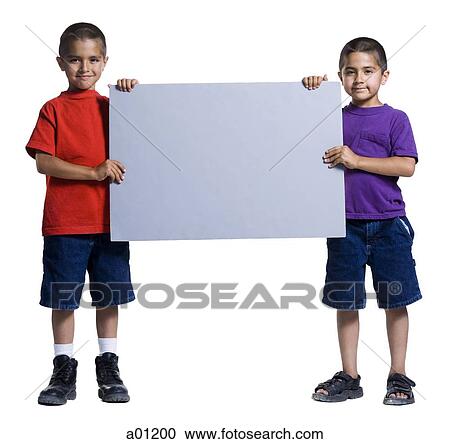 Stock Image - Two young brothers holding a blank sign. Fotosearch
