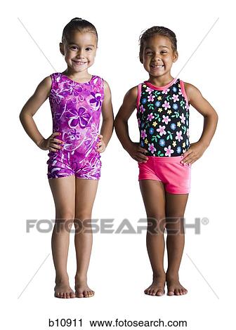 Two young female gymnasts with hands on hips View Large Photo Image Stock Image - Two young female gymnasts with hands on hips. Fotosearch