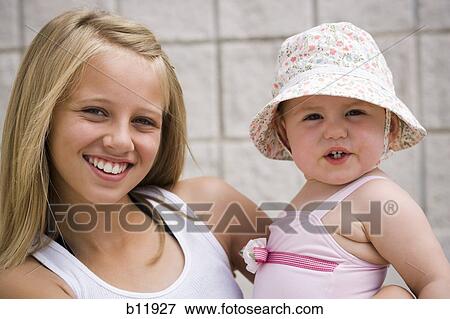 Two young sisters View Large Photo Image Stock Photo - Two young sisters. Fotosearch