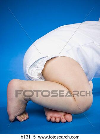 Stock Photography - Waist down view of a baby crawling. Fotosearch