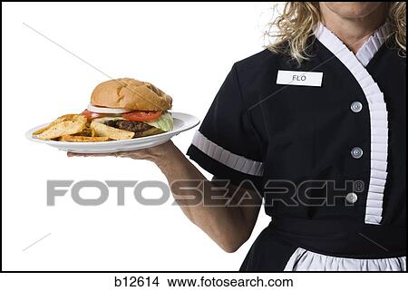 Picture - Waitress holding hamburger platter. Fotosearch