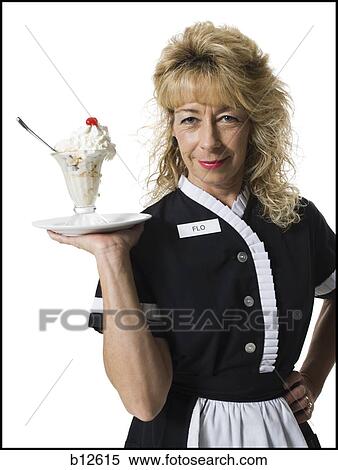 Waitress holding ice cream sundae View Large Photo Image Stock Photography - Waitress holding ice cream sundae. Fotosearch