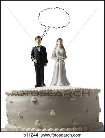 Wedding cake visual metaphor with figurine cake toppers View Large Photo Image Picture - Wedding cake visual metaphor with figurine cake toppers. Fotosearch