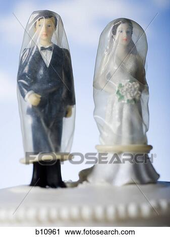 Wedding cake visual metaphor with figurine cake toppers View Large Photo Image Stock Image - Wedding cake visual metaphor with figurine cake toppers. Fotosearch