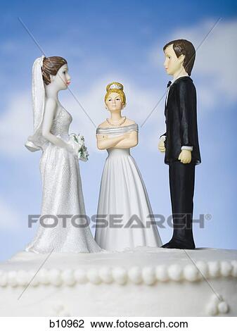 Wedding cake visual metaphor with figurine cake toppers View Large Photo Image Stock Image - Wedding cake visual metaphor with figurine cake toppers. Fotosearch