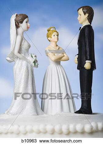 Wedding cake visual metaphor with figurine cake toppers View Large Photo Image Stock Image - Wedding cake visual metaphor with figurine cake toppers. Fotosearch