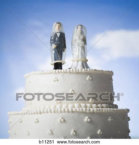 Wedding cake visual metaphor with figurine cake toppers View Large Photo Image Stock Image - Wedding cake visual metaphor with figurine cake toppers. Fotosearch